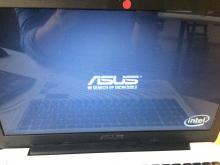 Photograph of laptop showing ASUS logo